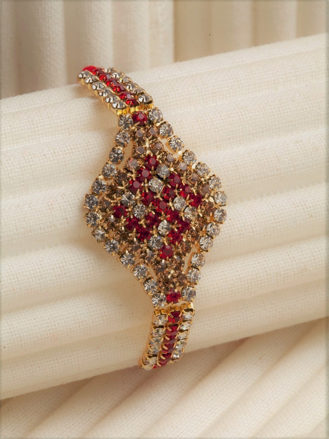 

PANASH Gold-Toned & Red AD Stoned-Studded Swastik Rakhi With Roli Chawal