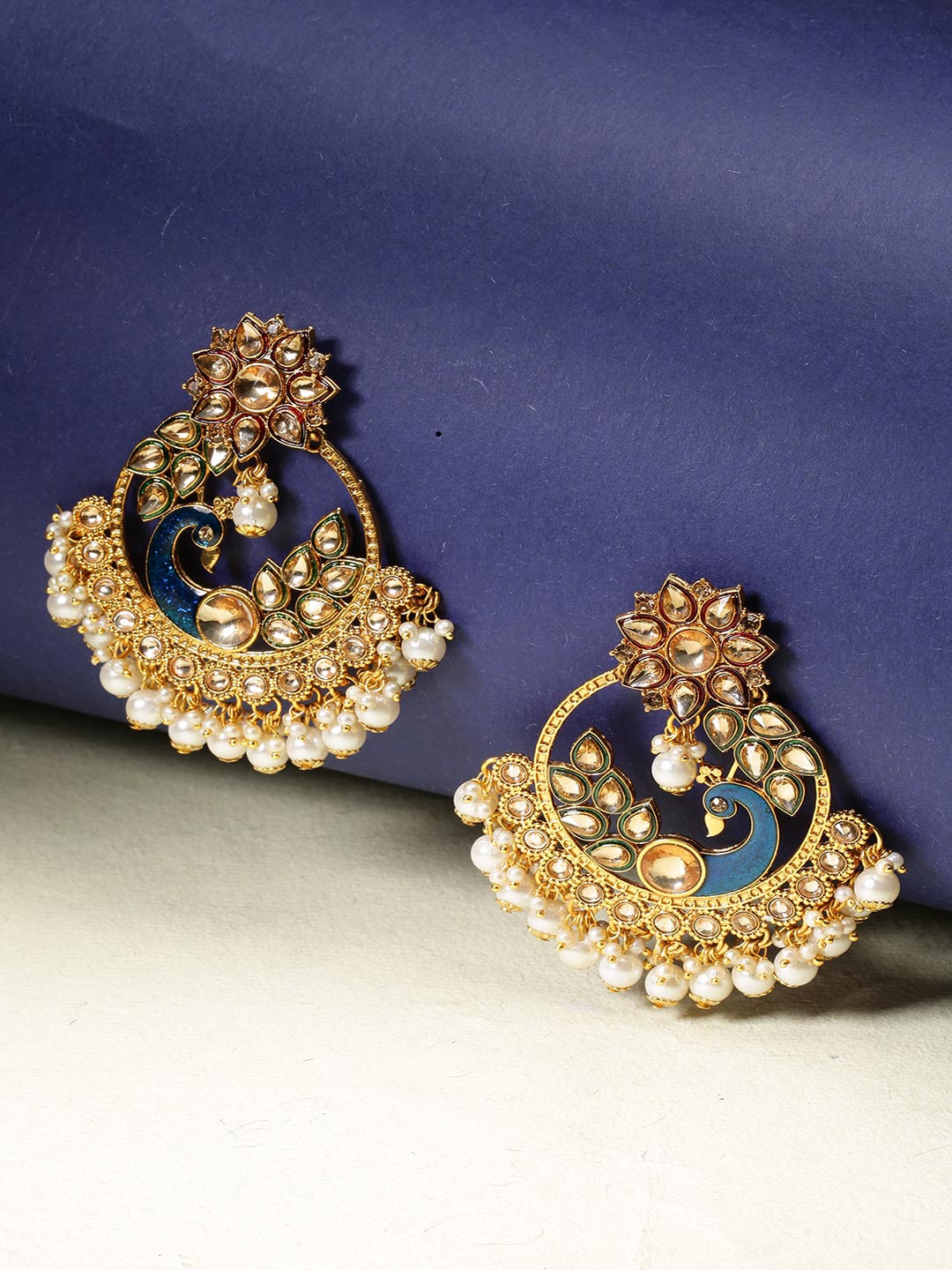 

Priyaasi Gold-Toned Blue Stone Studded Pearl Beaded Peacock Chandbali Earrings