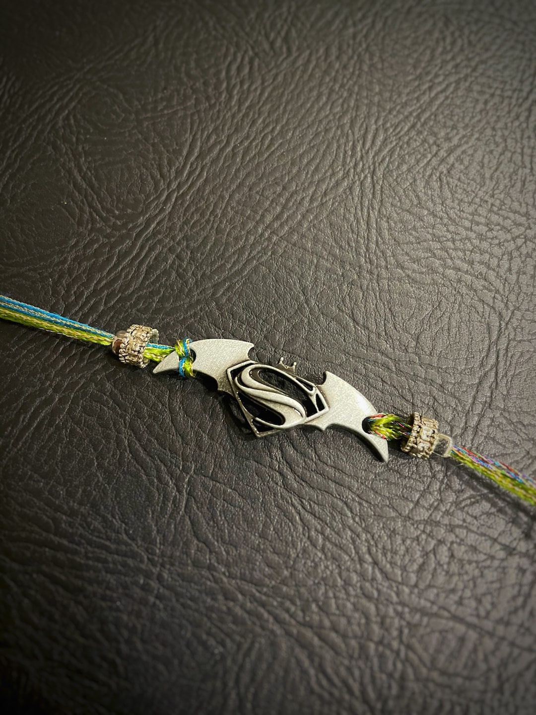 

Digital Dress Room Multi Superman Pendant Rakhi