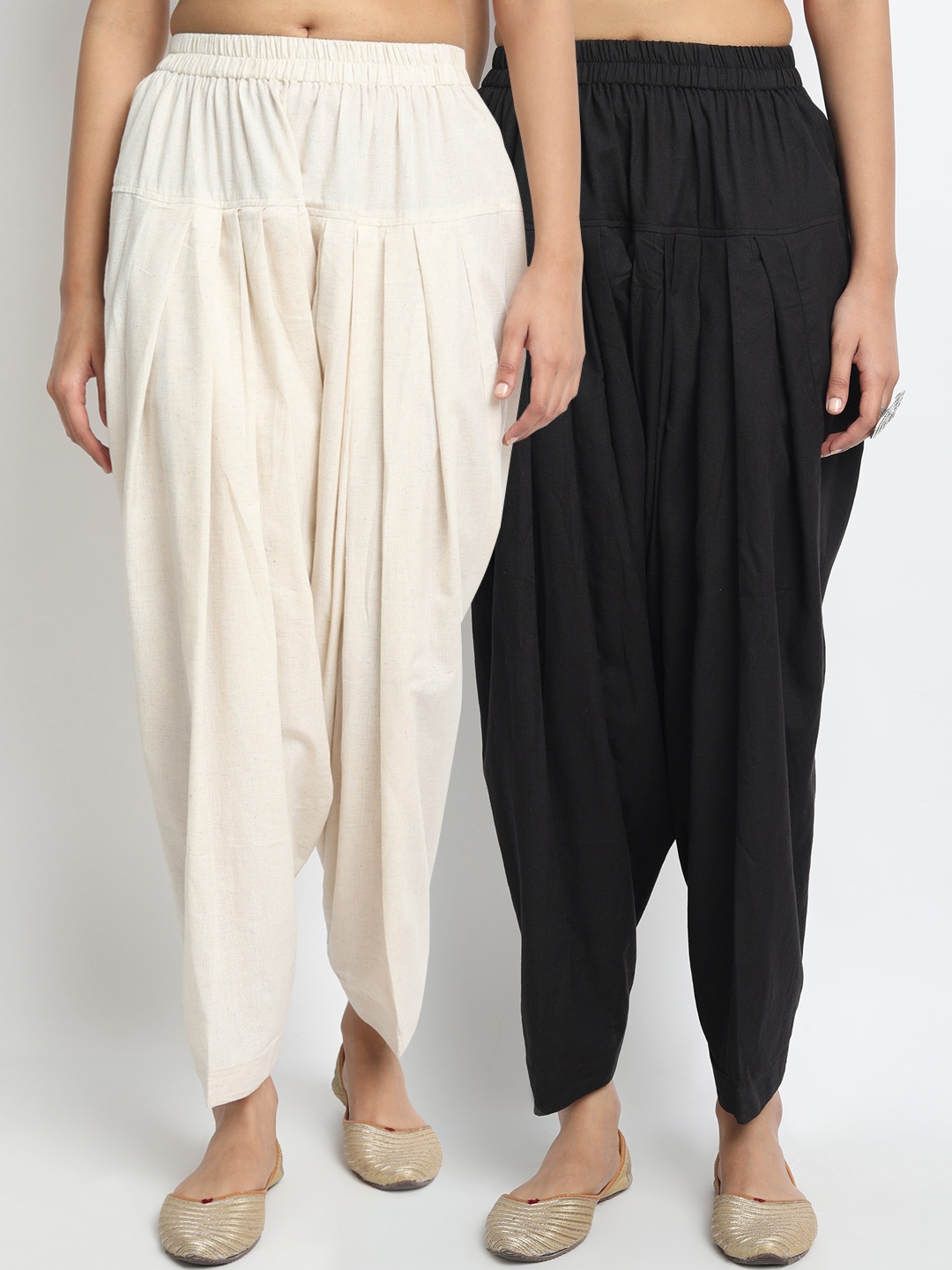 

Molcha Women Pack Of 2 Black & Off White Solid Pure Cotton Loose-Fit Salwars
