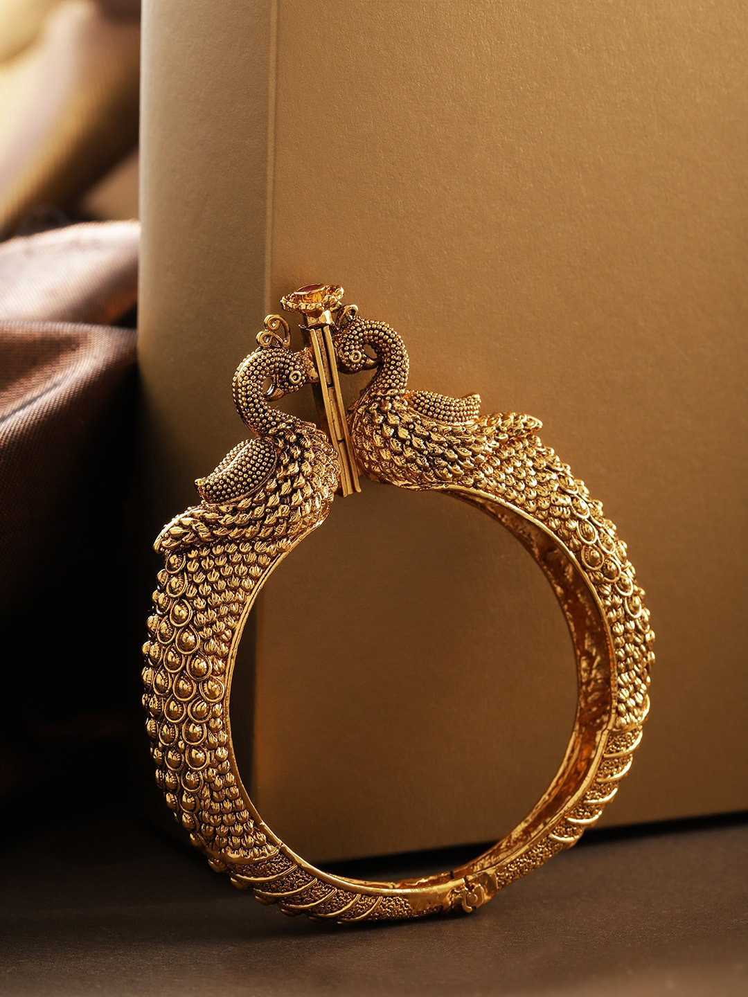 

Priyaasi Gold-Plated Ruby Studded Peacock Inspired Textured Openable Bangle