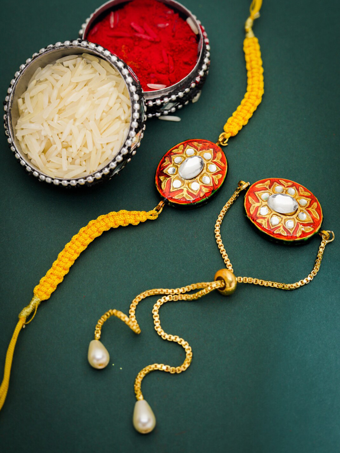 

Shoshaa Red & Gold-Toned Meenakari Kundan-Studded Bhai Bhabhi Rakhi Combo