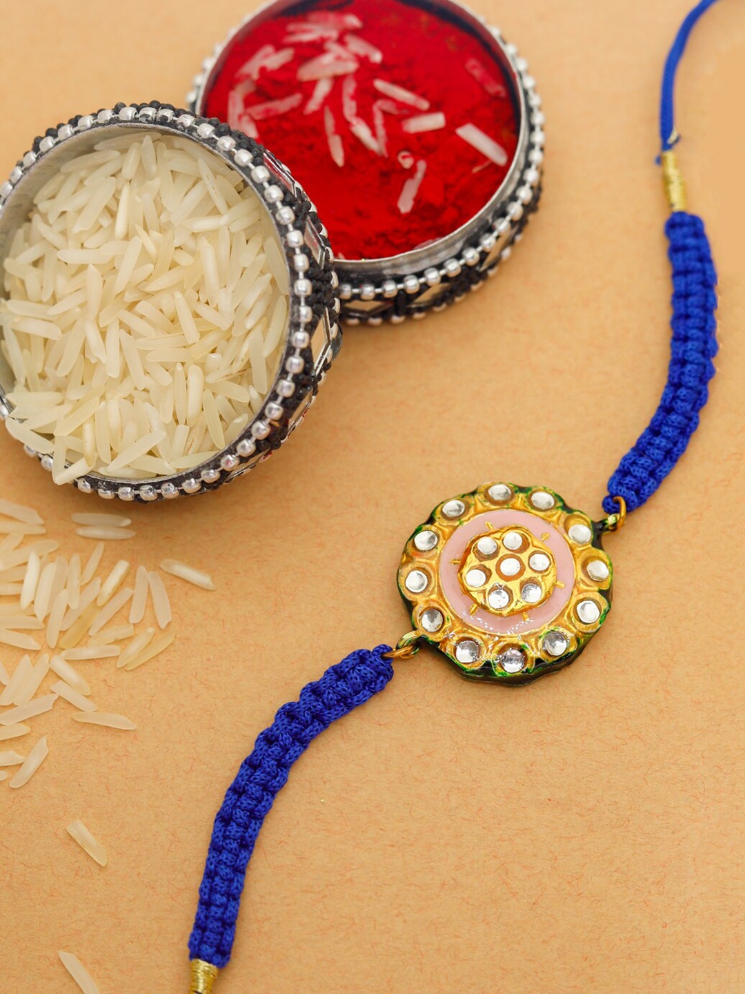 

Shoshaa Peach-Coloured Kundan Design Meenakari Single Bhai Rakhi