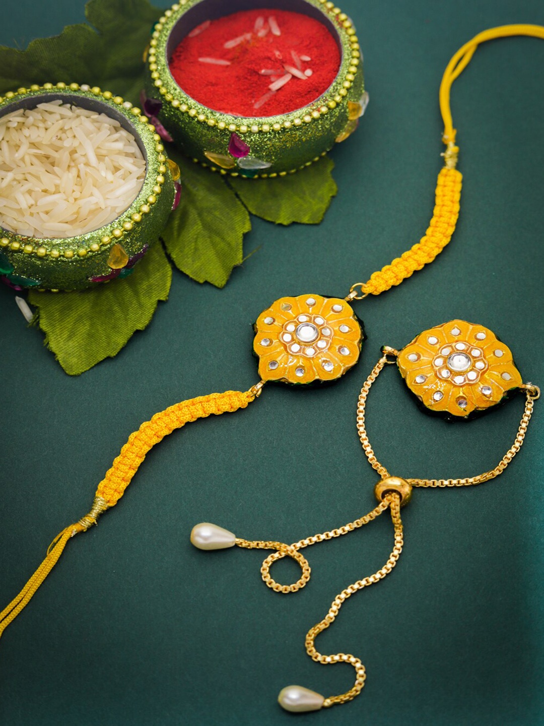

Shoshaa Yellow Reversible Design Meenakari Kundan Studded Rakhi Combo