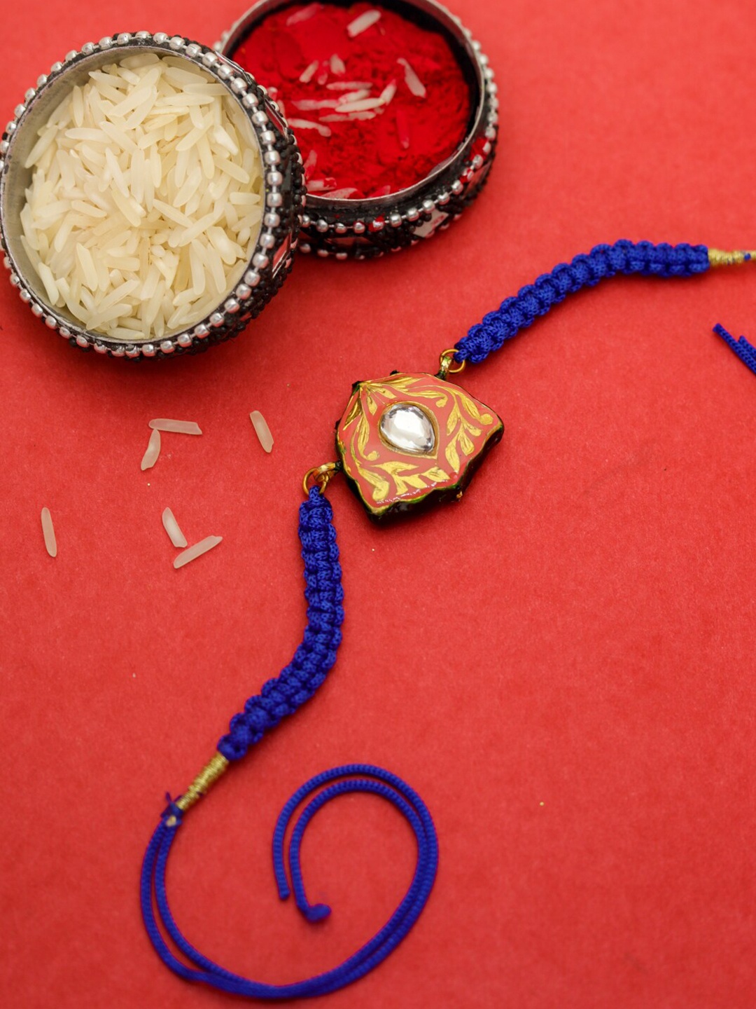 

Shoshaa Gold & Blue Orange Meenakari Design Kundan Single Bhai Rakhi