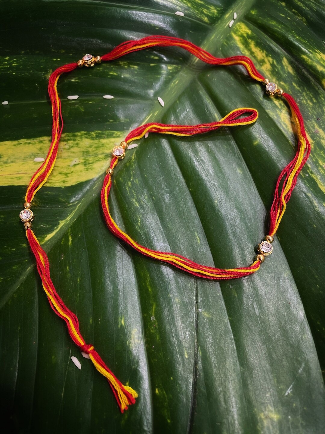 

Digital Dress Room Red & Yellow Charm Mauli Thread Rakhi