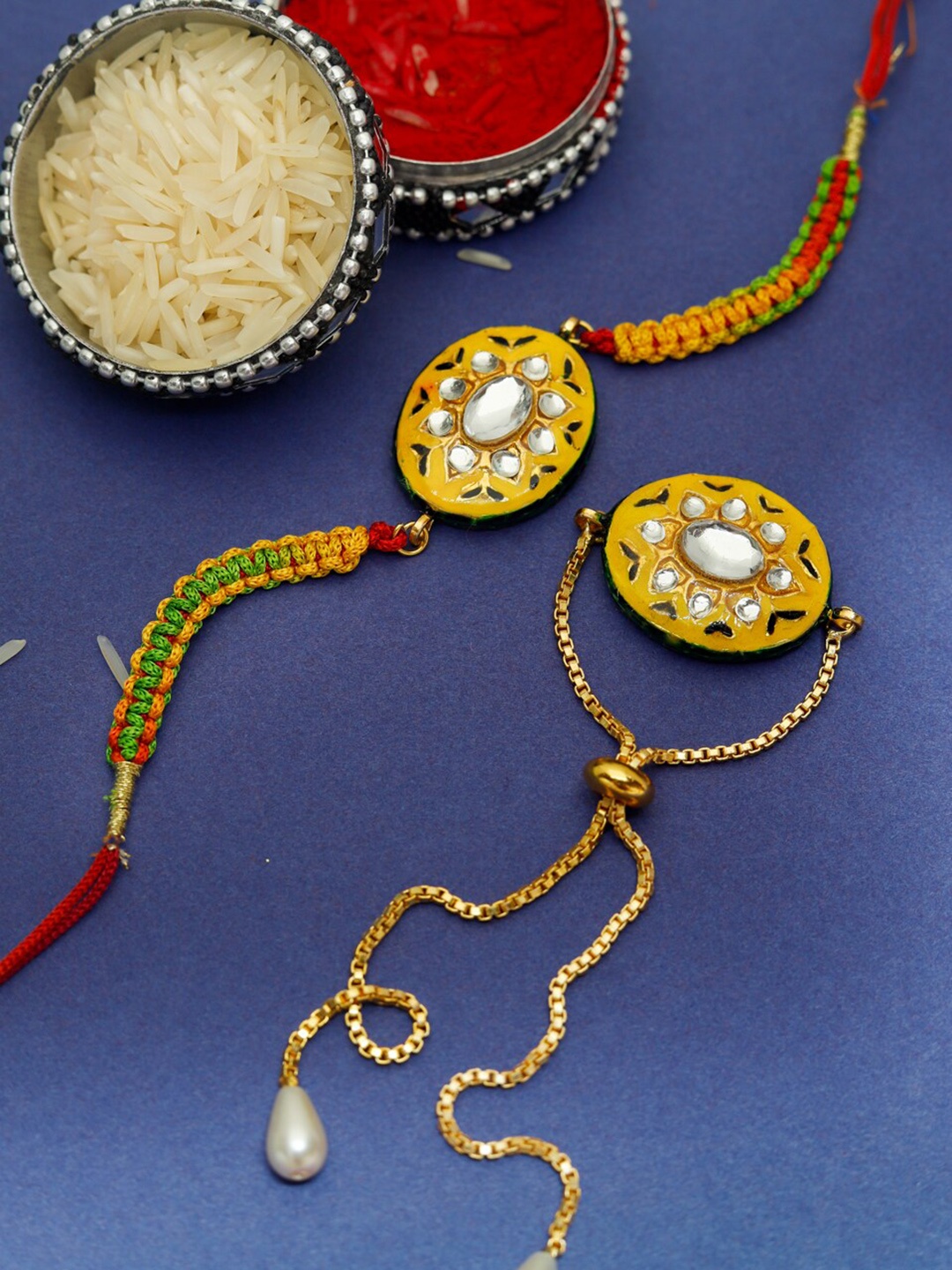 

Shoshaa Yellow & Gold 2 Pc Reversible Meenakari Kundan Studded Bhai Bhabhi Rakhi Set