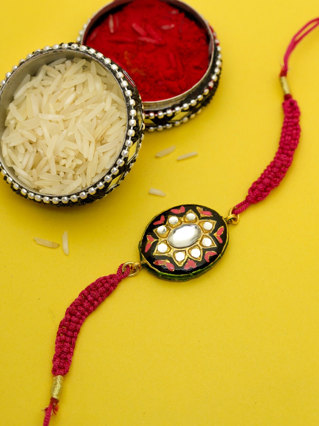 

Shoshaa Black & Red Kundan Reversible Design Meenakari Rakhi