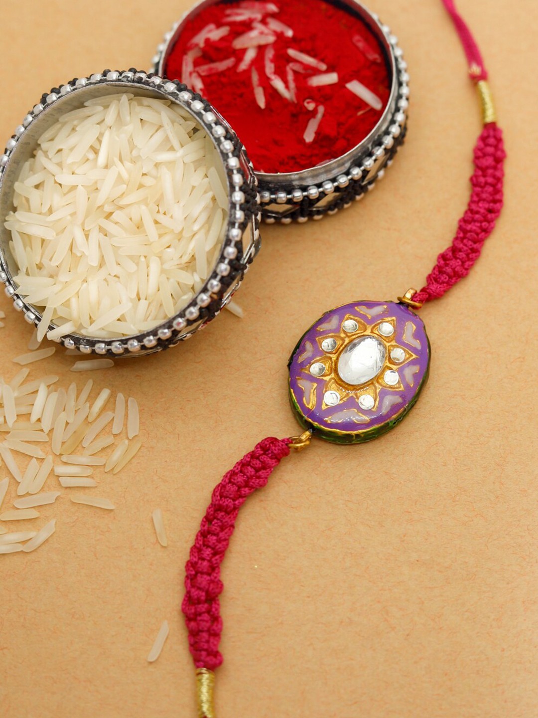 

Shoshaa Purple & Red Kundan Reversible Meenakari Single Bhai Rakhi