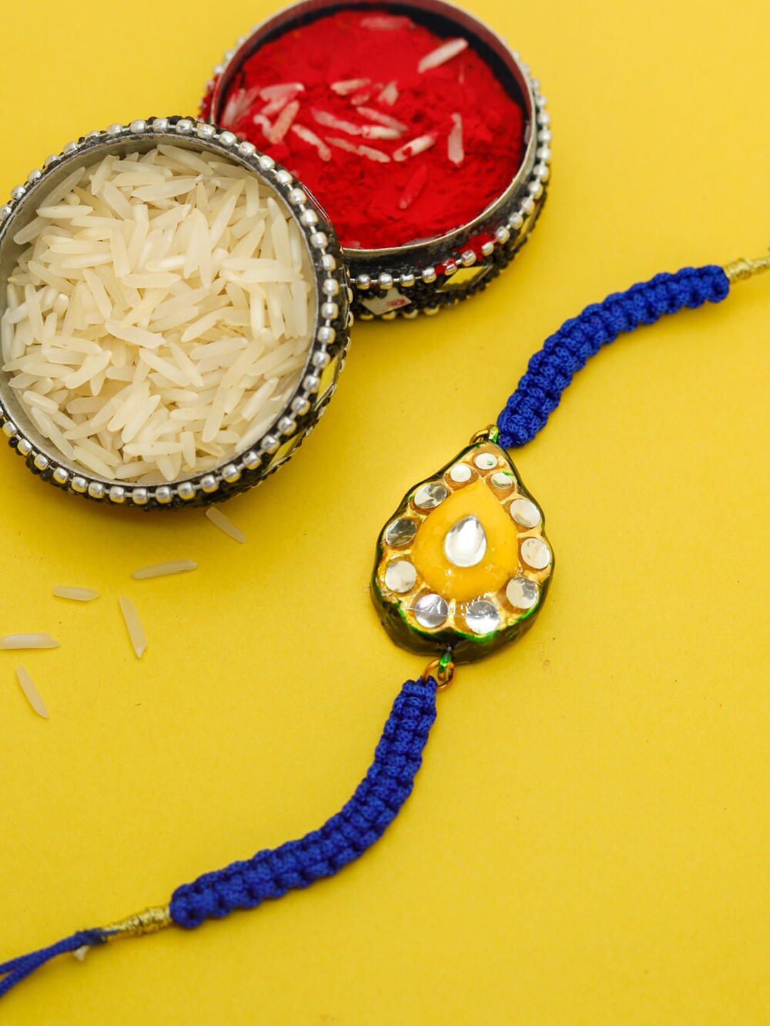 

Shoshaa Yellow & Blue Kundan Reversible Meenakari Bhai Rakhi