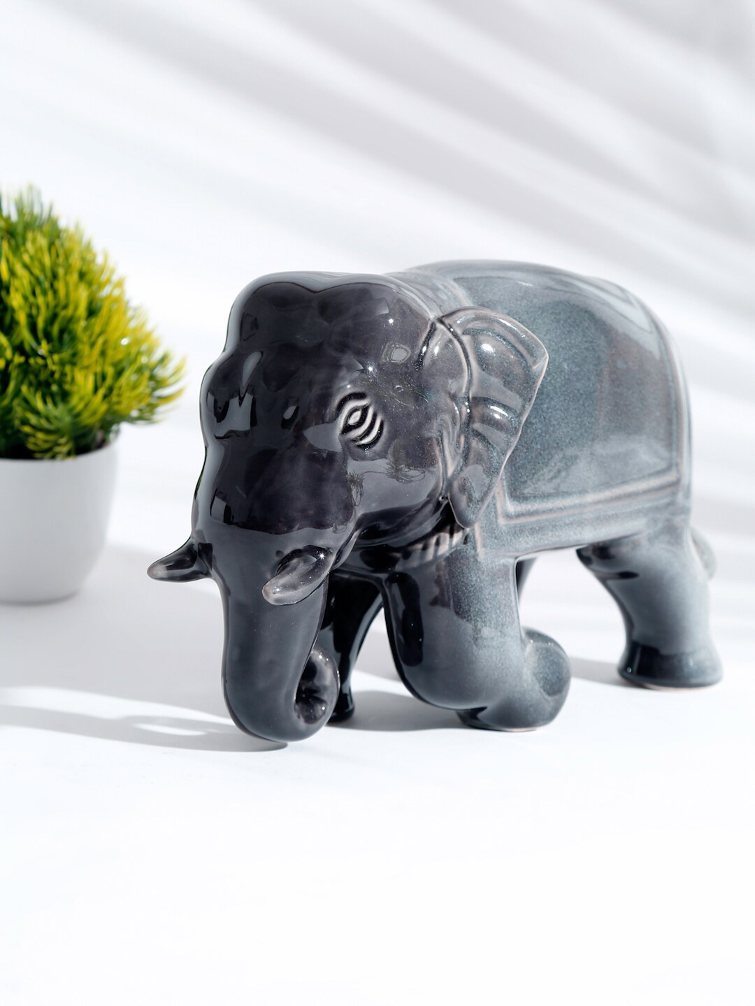 

Fabindia Grey Solid Mitul Glazed Elephant Showpiece