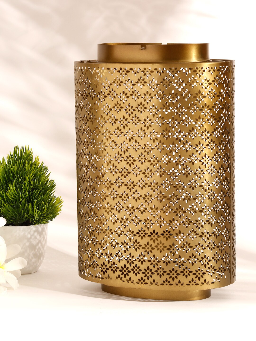 

Fabindia Bronze-Toned Cutwork Tea-Light Candle Holder
