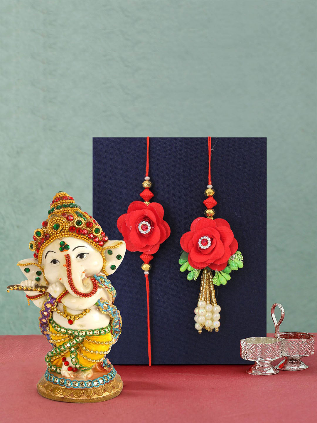 

TIED RIBBONS Multicolored Handcrafted Bhaiya Bhabhi Lumba Rakhi & Ganesh Idol Gift Pack, Multi