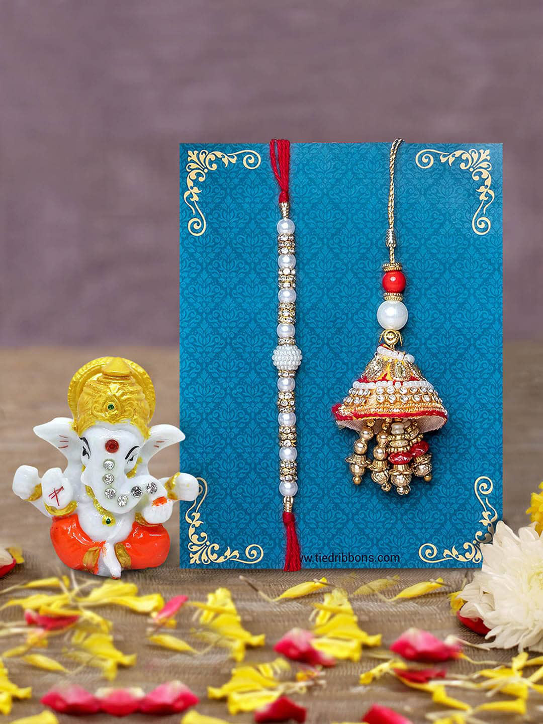 

TIED RIBBONS Red & White Bhaiya Bhabhi Lumba Rakhi with Ganesha Idol Combo Gift Set