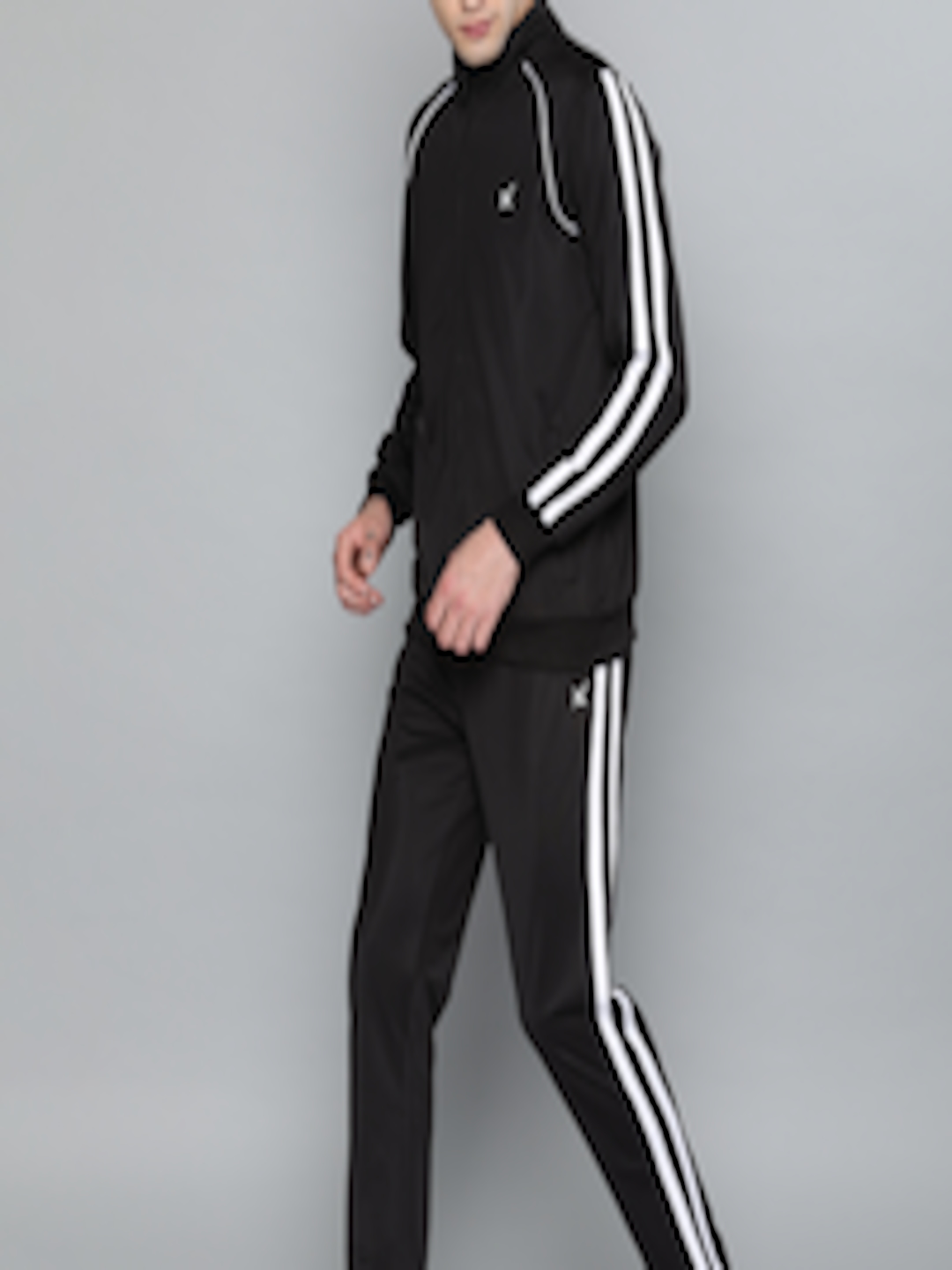 Buy HRX By Hrithik Roshan Men Black And White Solid Lifestyle Tracksuit ...