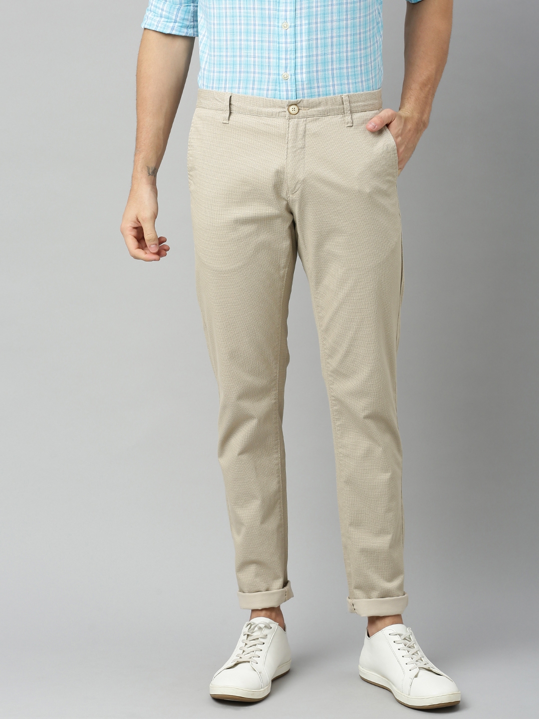 Buy U.S. Polo Assn. Men Beige Slim Fit Solid Regular Trousers ...