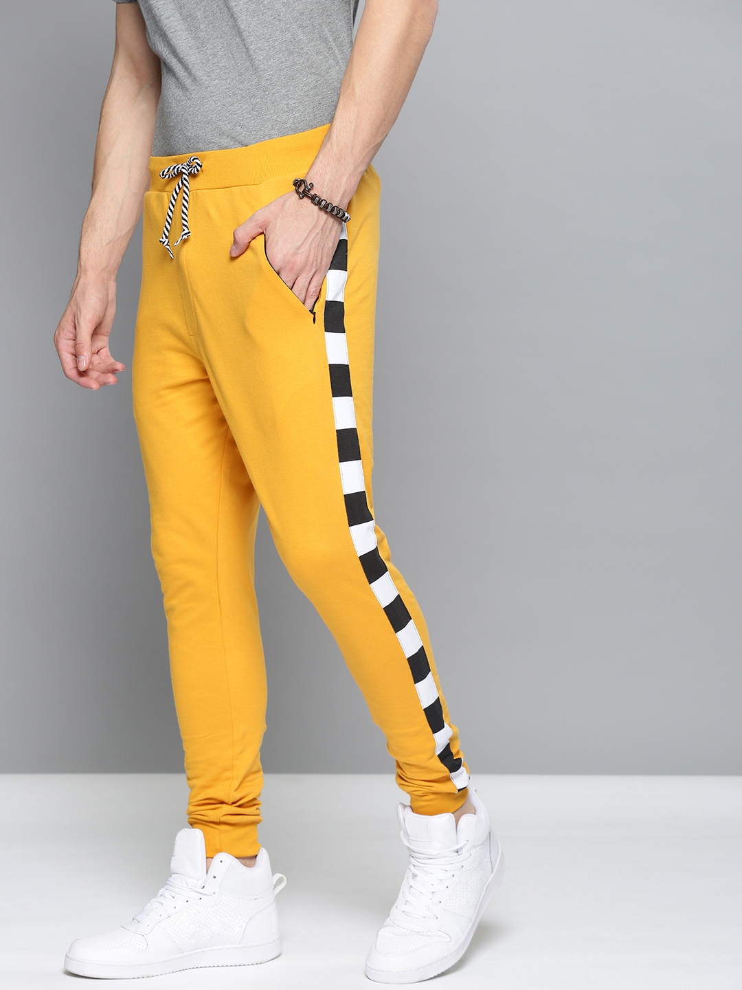 mustard track pants