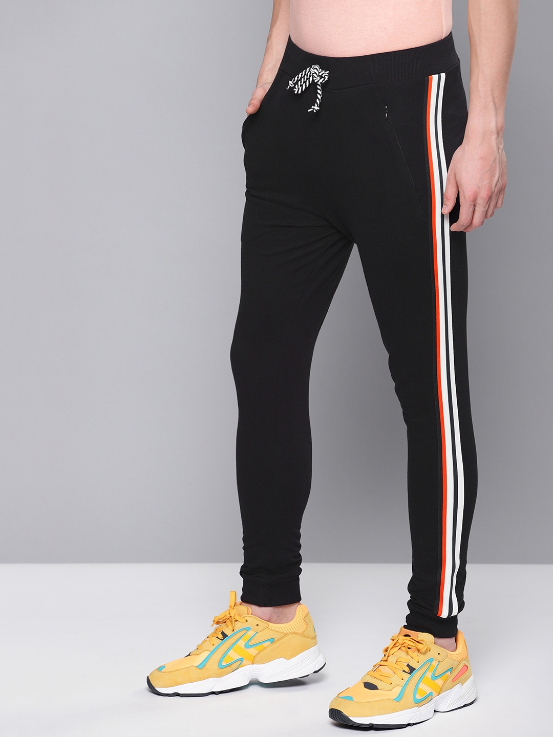 difference between track pants and trousers