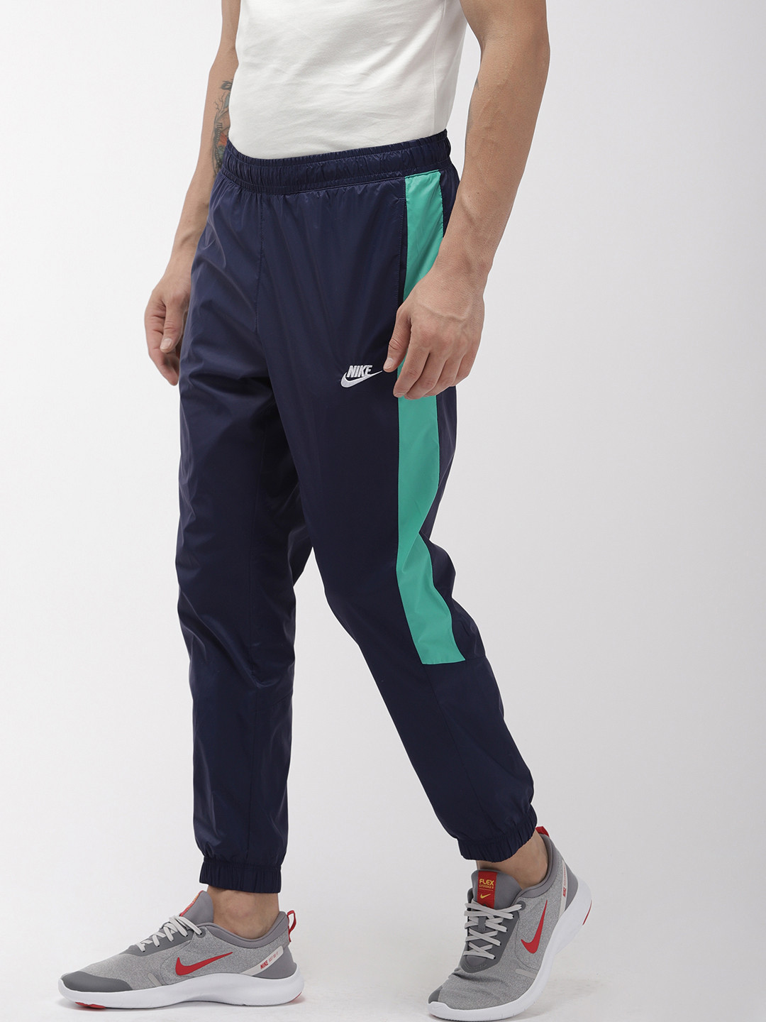 Buy Nike Men Blue NSW CE PANT CF WVN CRE TK Straight Fit Solid Joggers