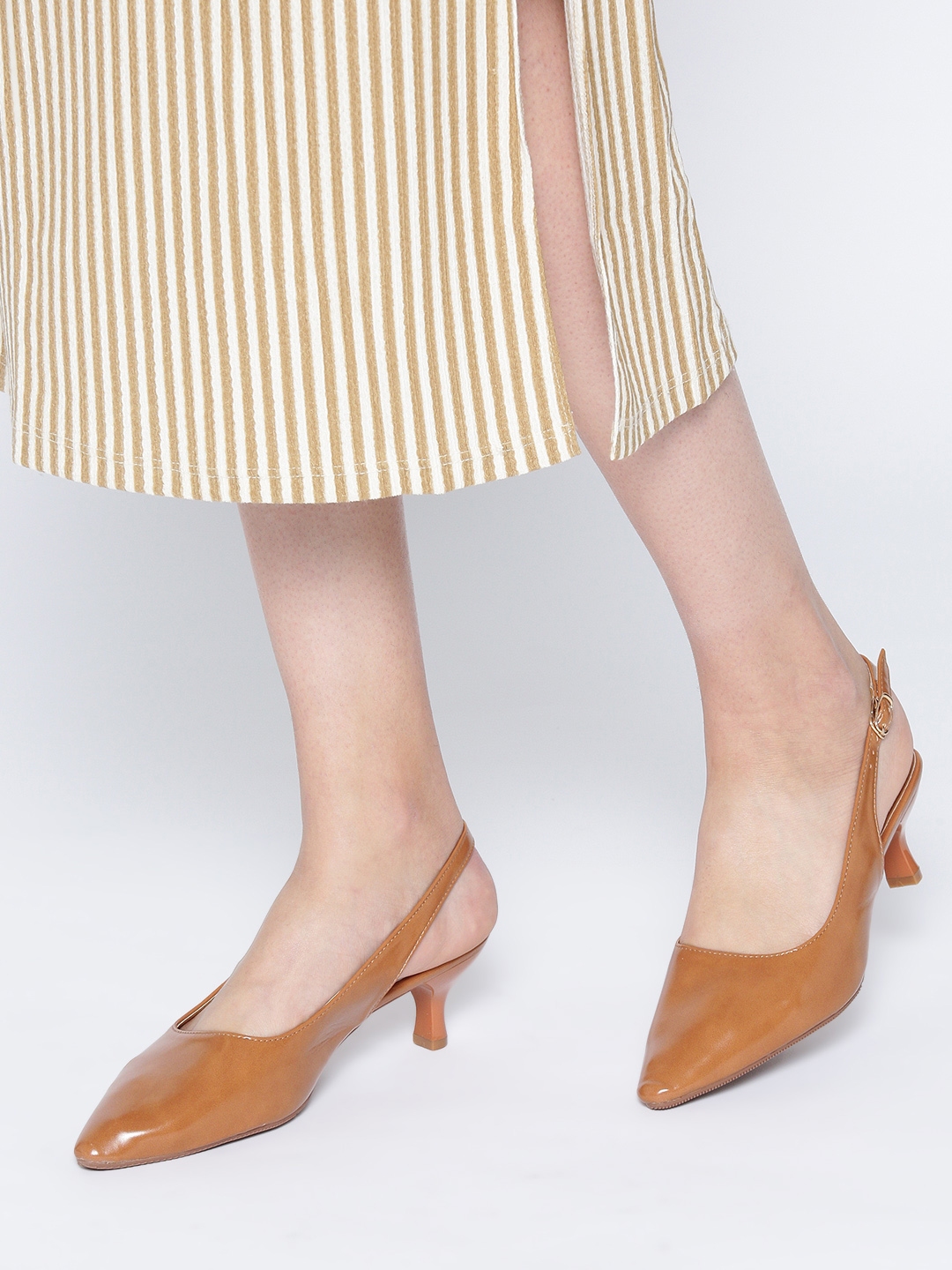 brown and white pumps