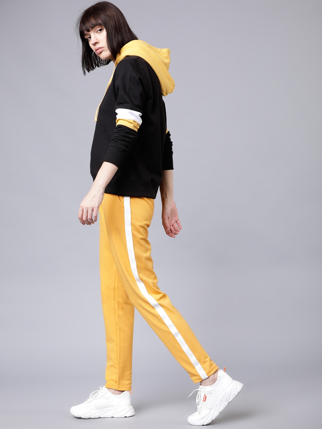 mustard track pants