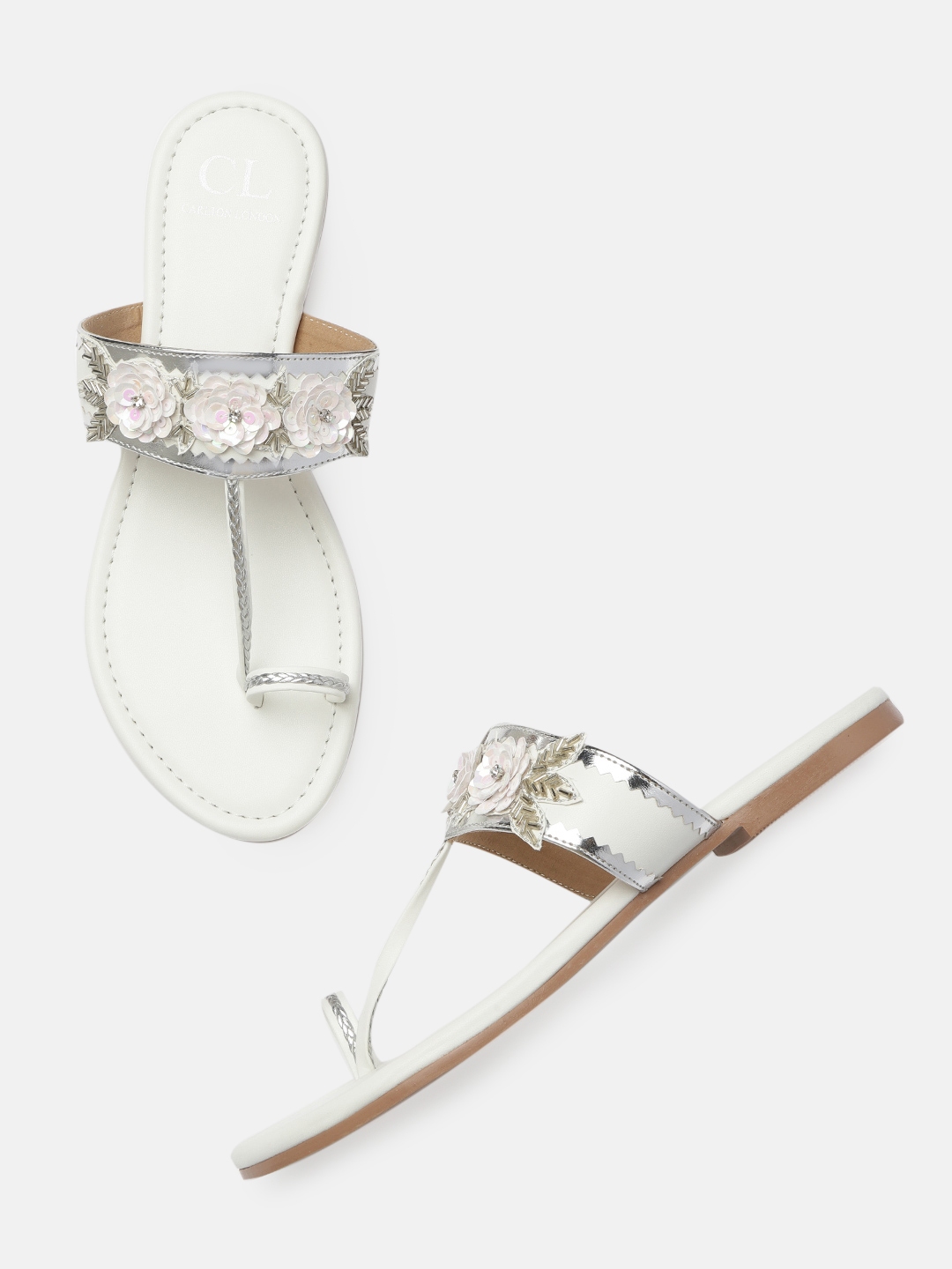 white and silver flats
