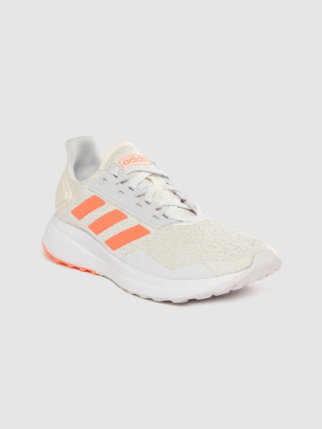 cream colored adidas sneakers