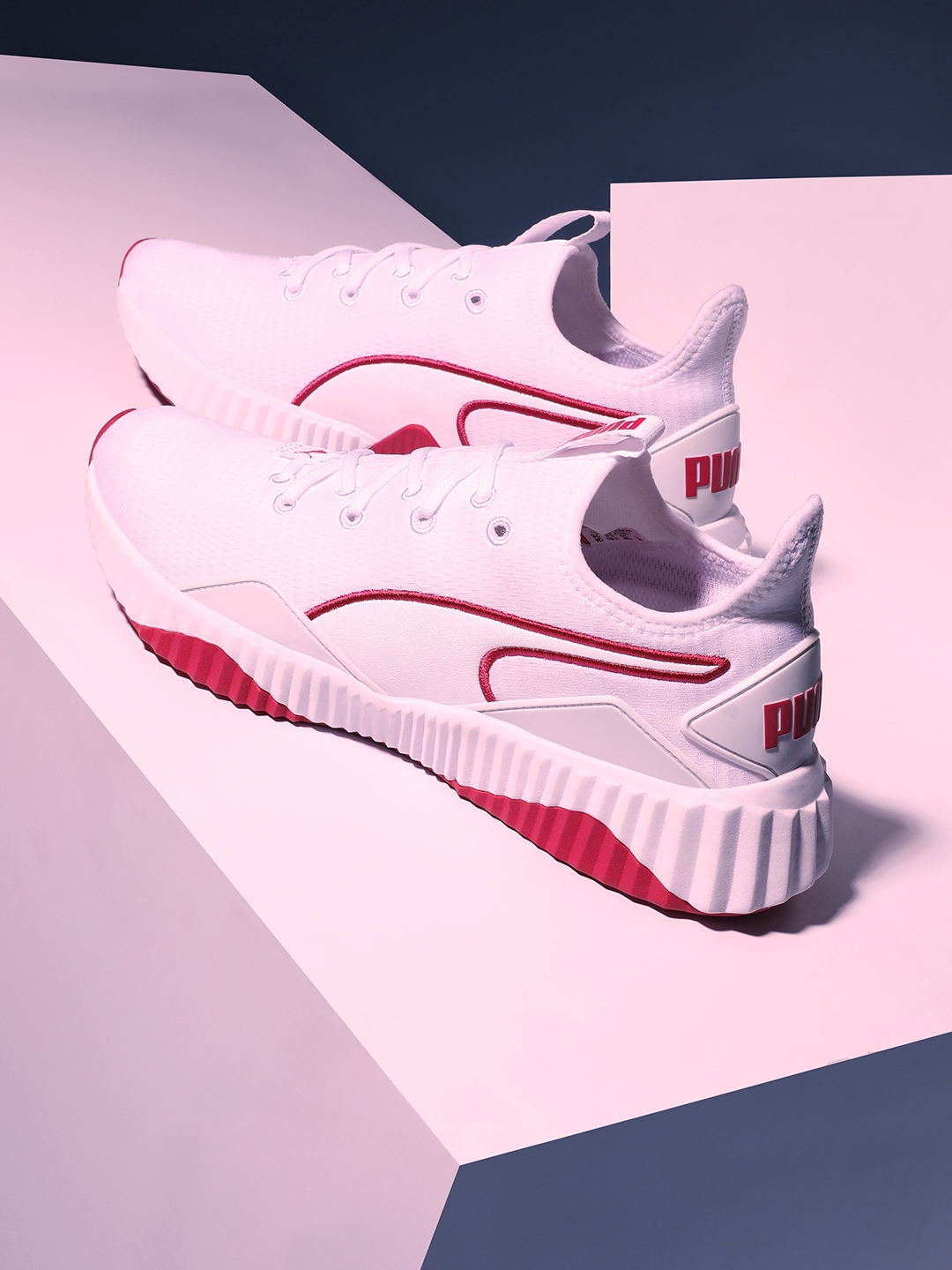 puma defy sneakers in white