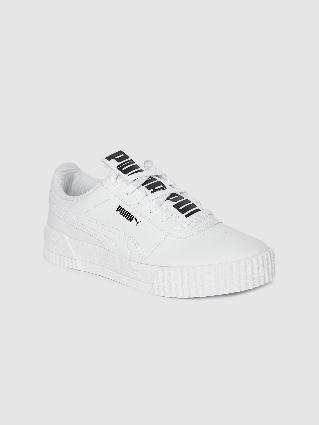 white puma carina sneakers