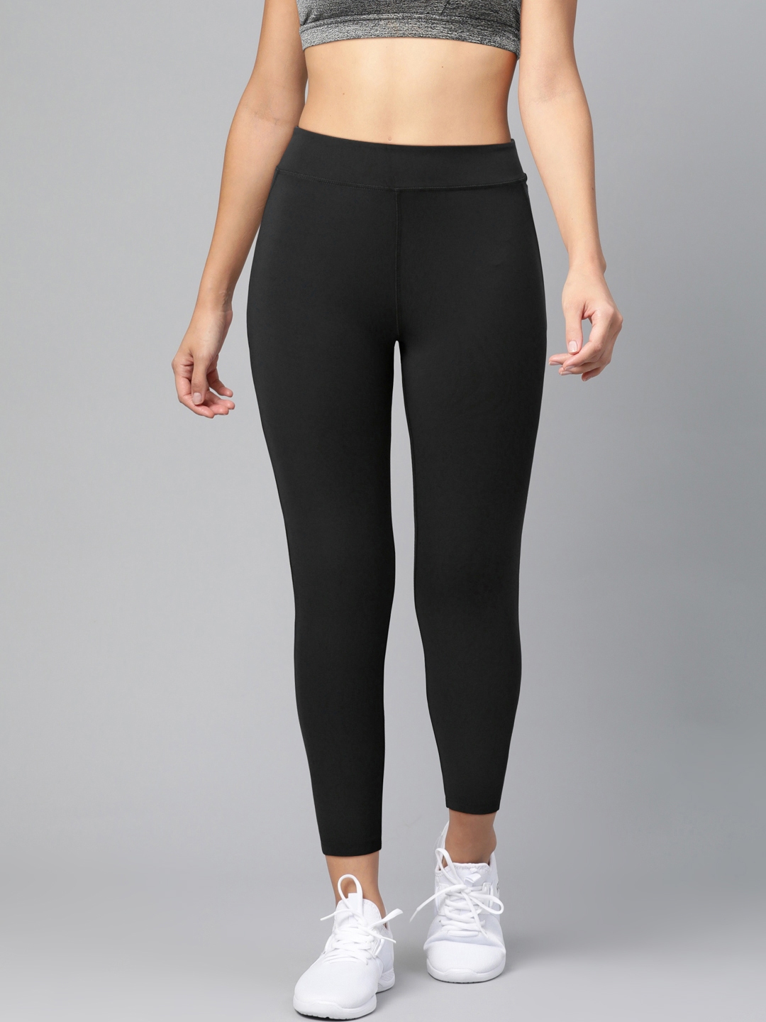 Buy Reebok Women Black Solid Workout Ready PP HR Training Tights ...