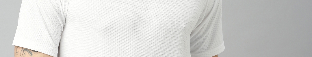 Buy Tommy Hilfiger Men White Solid Round Neck T Shirt - Tshirts for Men 12038730 | Myntra