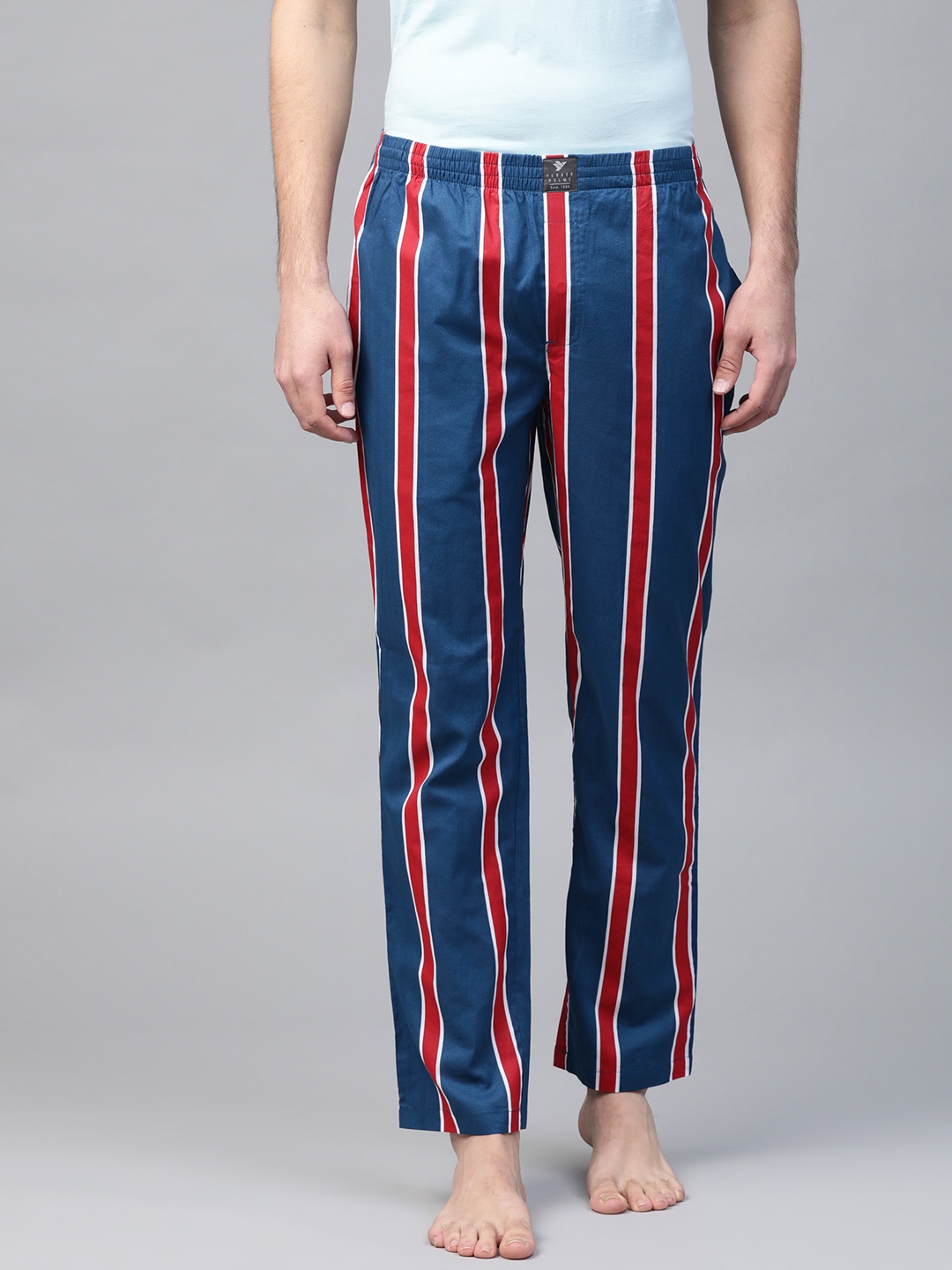 navy blue track pants with red stripe