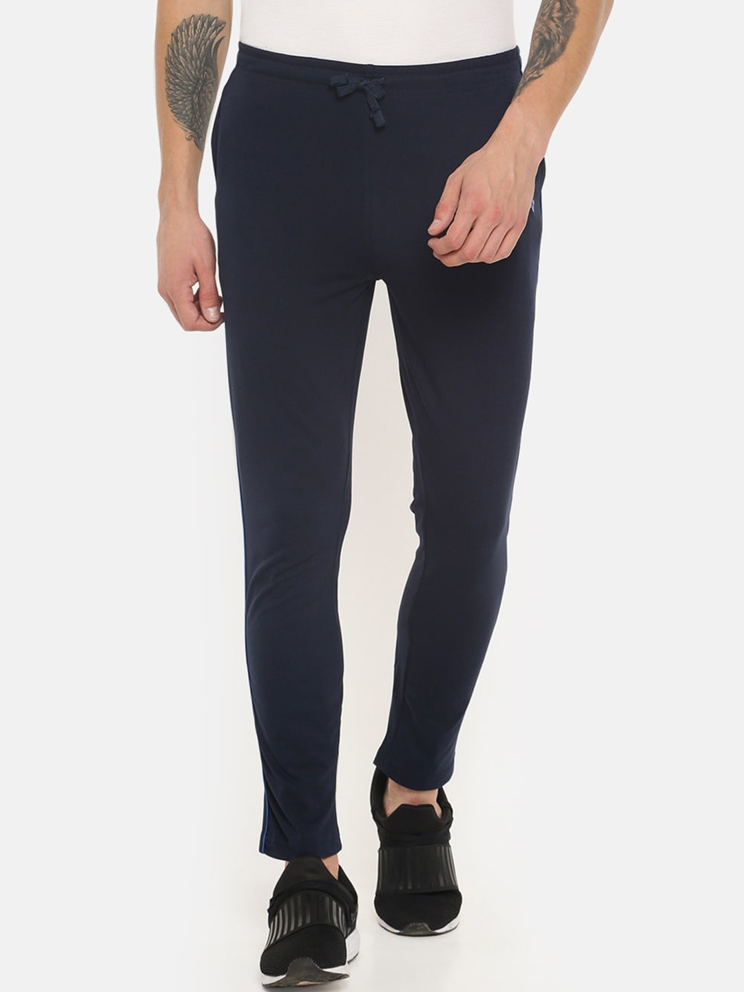 blue track pants with white stripes