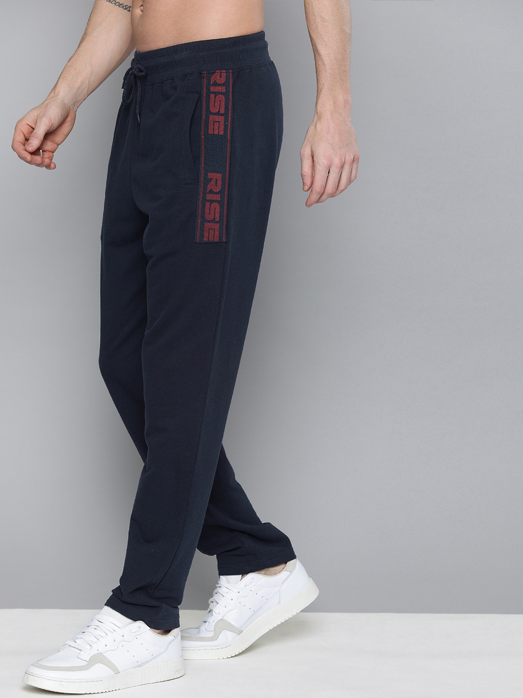navy blue track pants with red stripe