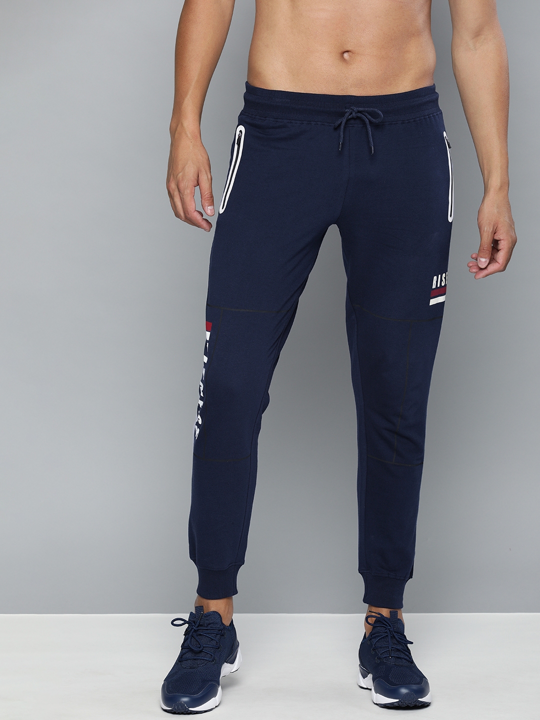 navy blue track pants with red stripe