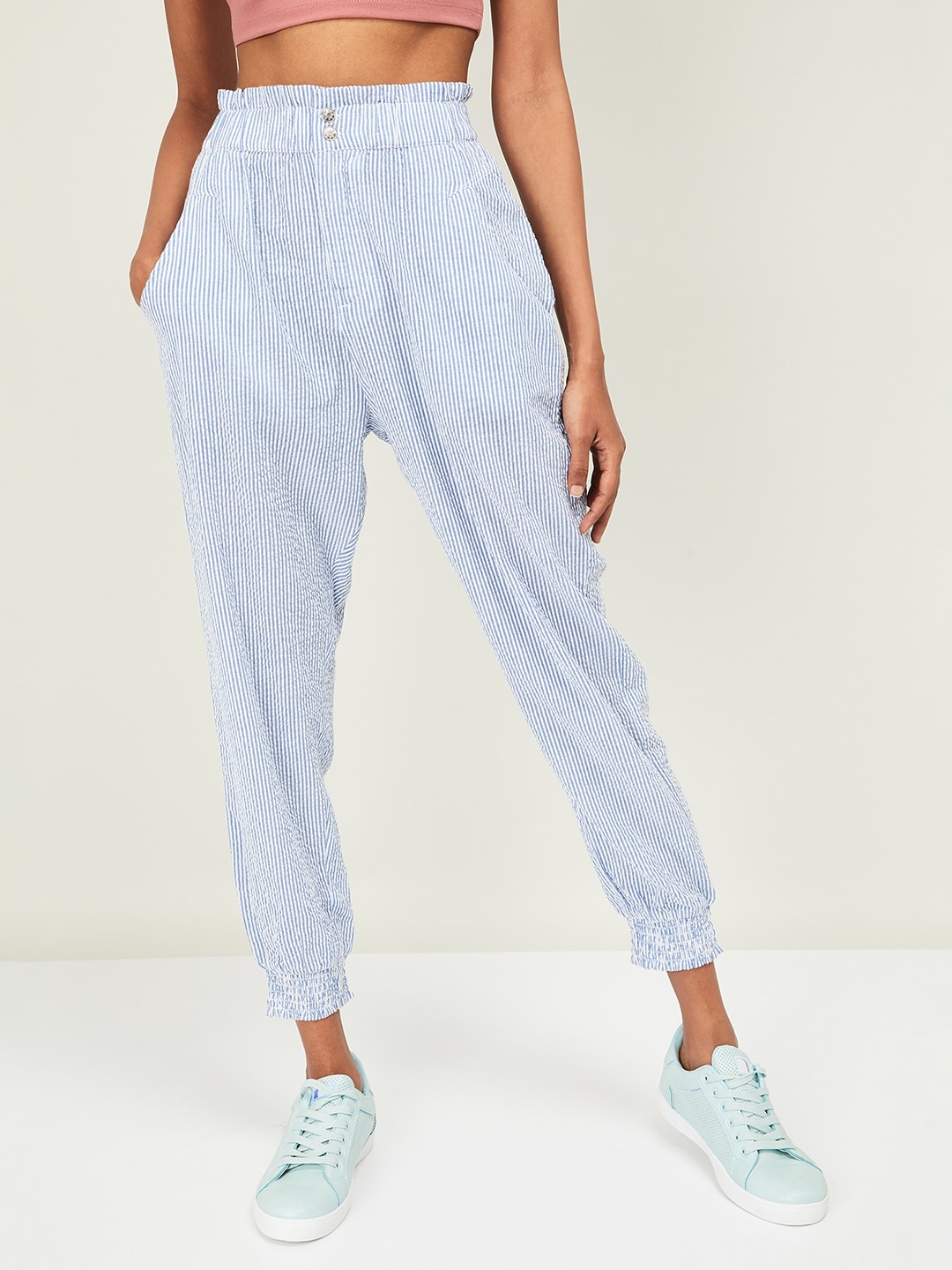 blue joggers with white stripe
