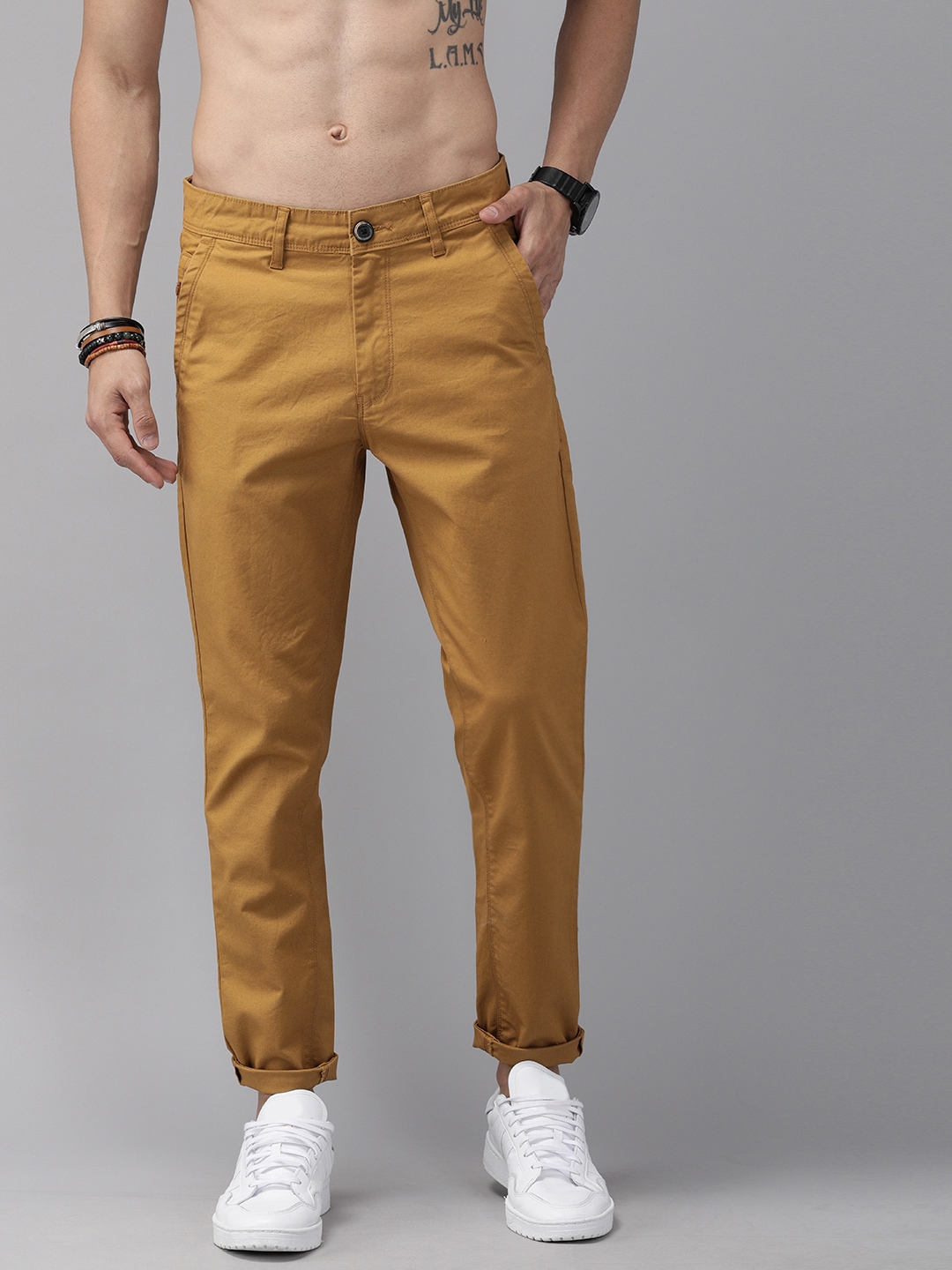 Buy Roadster Men Mustard Yellow Regular Fit Solid Regular Trousers ...
