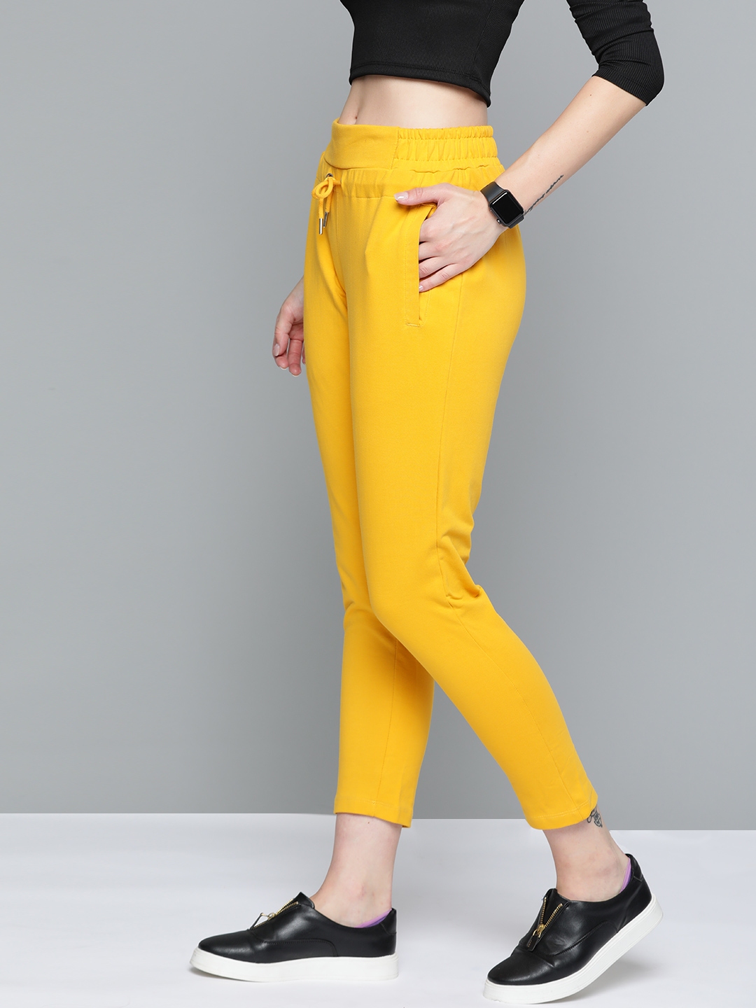 mustard track pants
