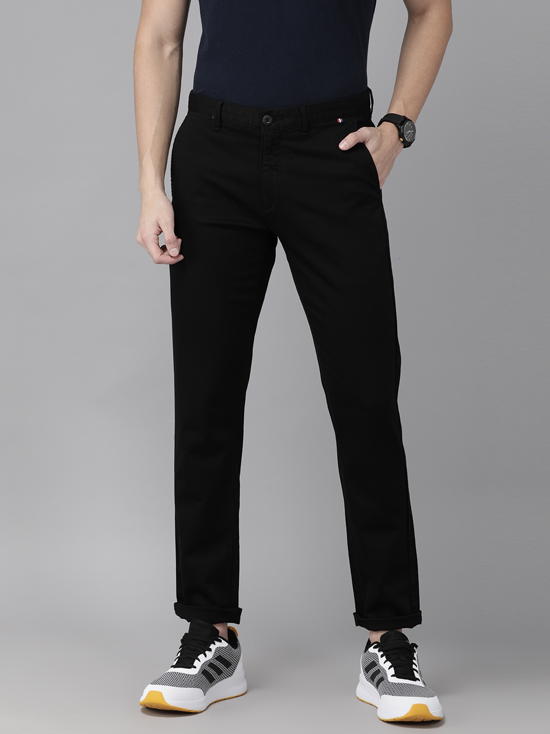 Buy U.S. Polo Assn. Men Black Slim Fit Solid Regular Trousers ...