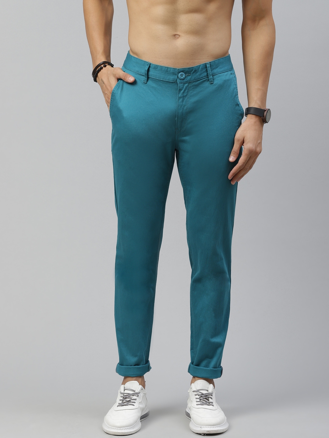 Buy Roadster Men Teal Green Tapered Fit Solid Regular Trousers ...
