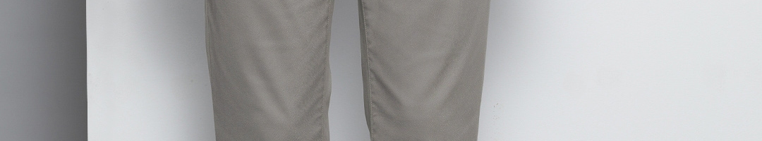 Buy Tommy Hilfiger Men Grey Tapered Fit Solid Regular Trousers ...
