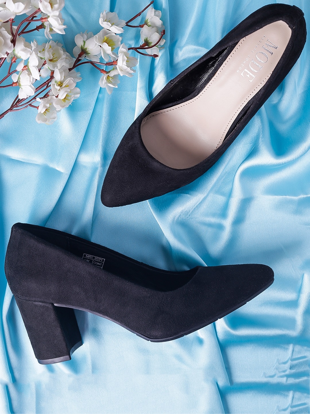 mode by red tape pumps