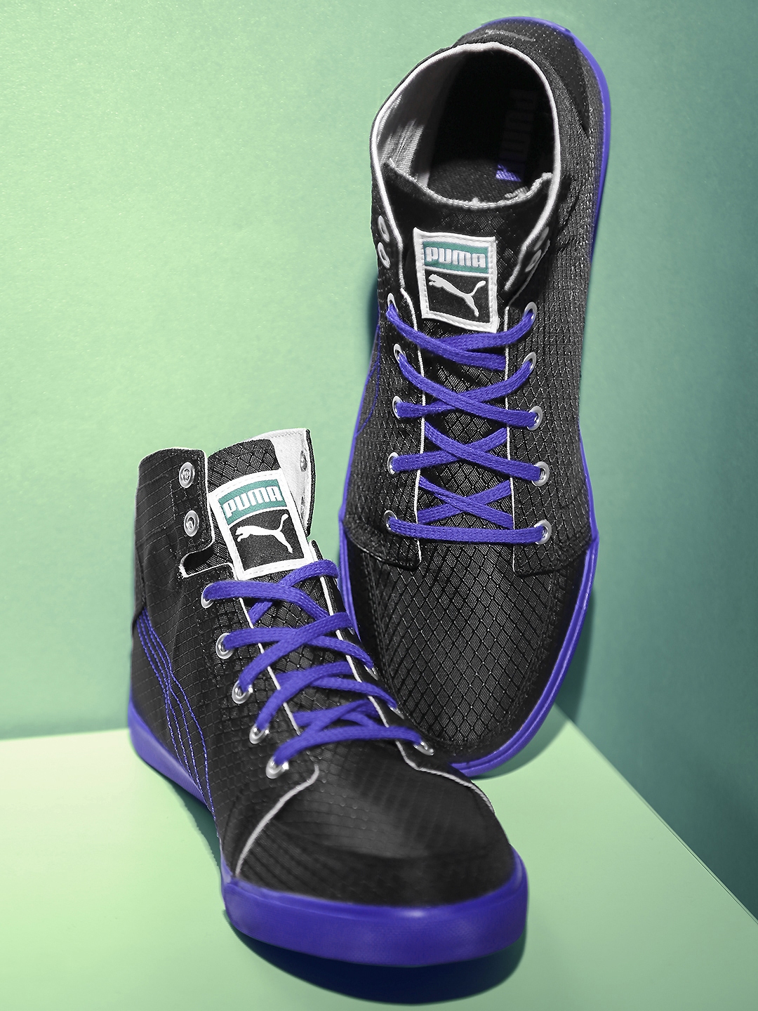 puma black and purple shoes