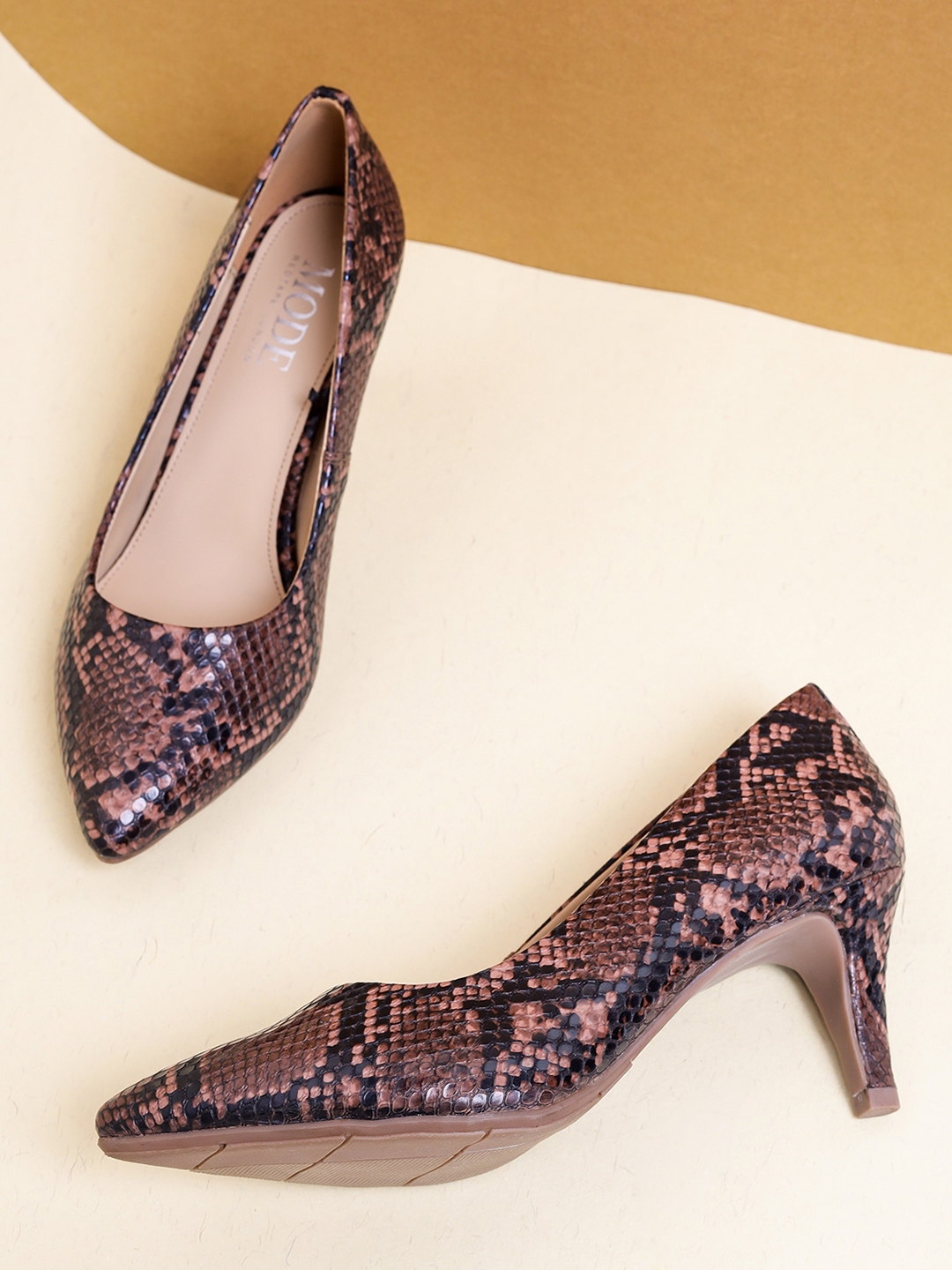 mode by red tape pumps