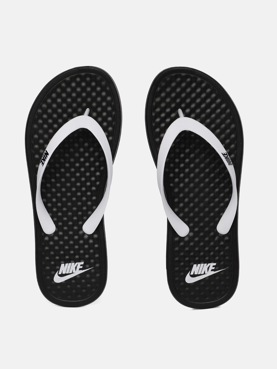 all white nike flip flops