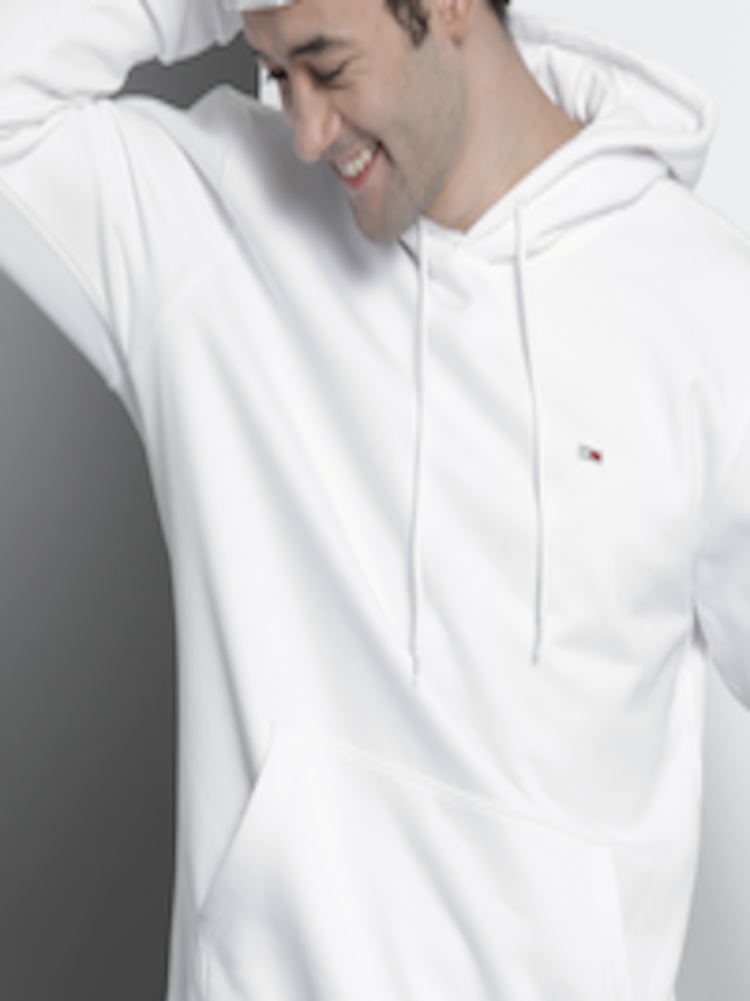 Buy Tommy Hilfiger Men White Solid Hooded Sweatshirt - Sweatshirts for ...