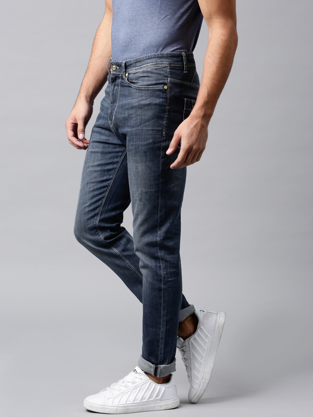 Buy HRX By Hrithik Roshan Men Blue Tapered Fit Stretchable Jeans ...