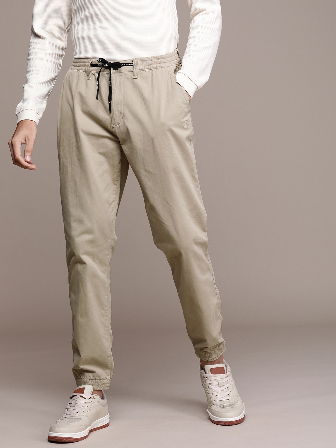 Buy Calvin Klein Jeans Men Beige Solid Chinos - Trousers for Men ...
