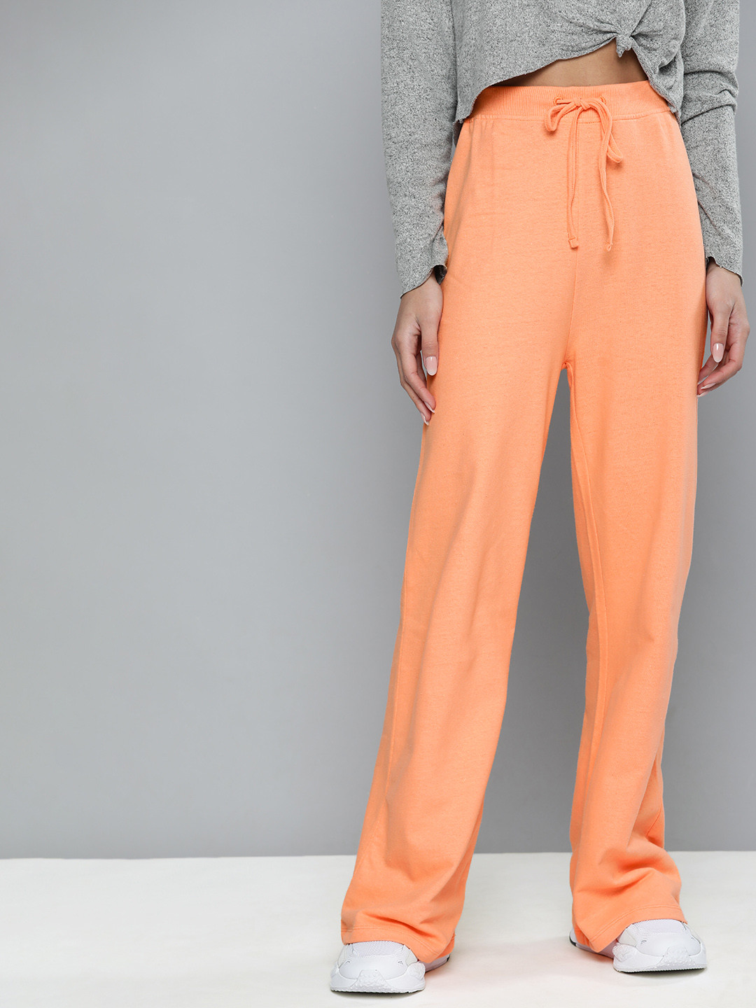 Buy Harvard Women Peach Solid Regular Fit Mid Rise Flared Track Pants