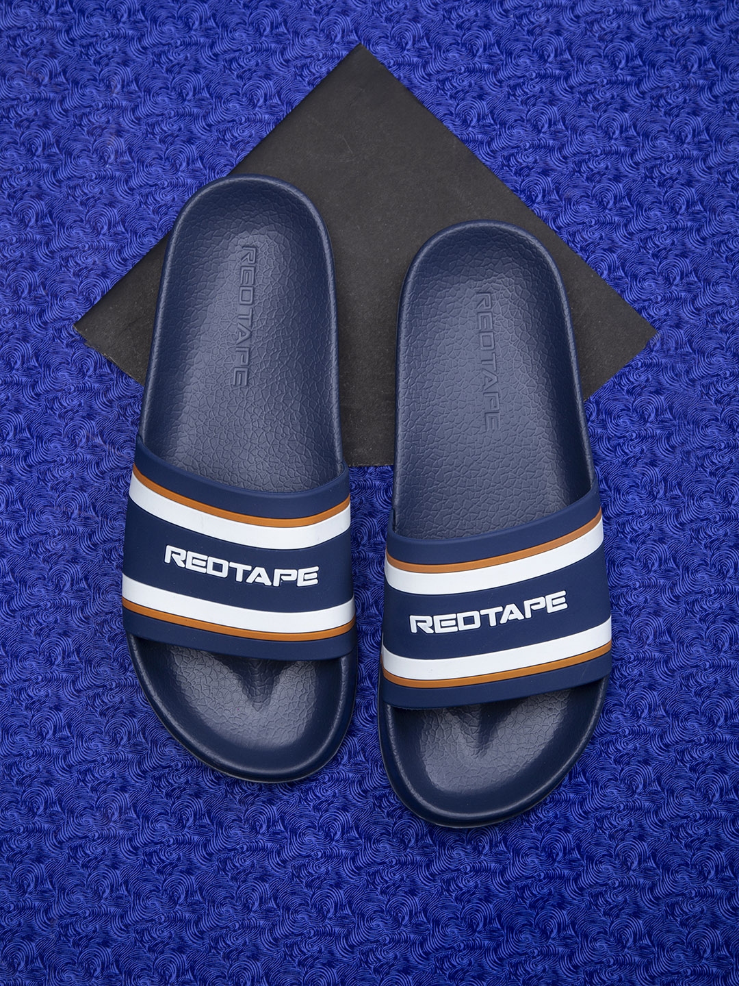red tape flip flops white